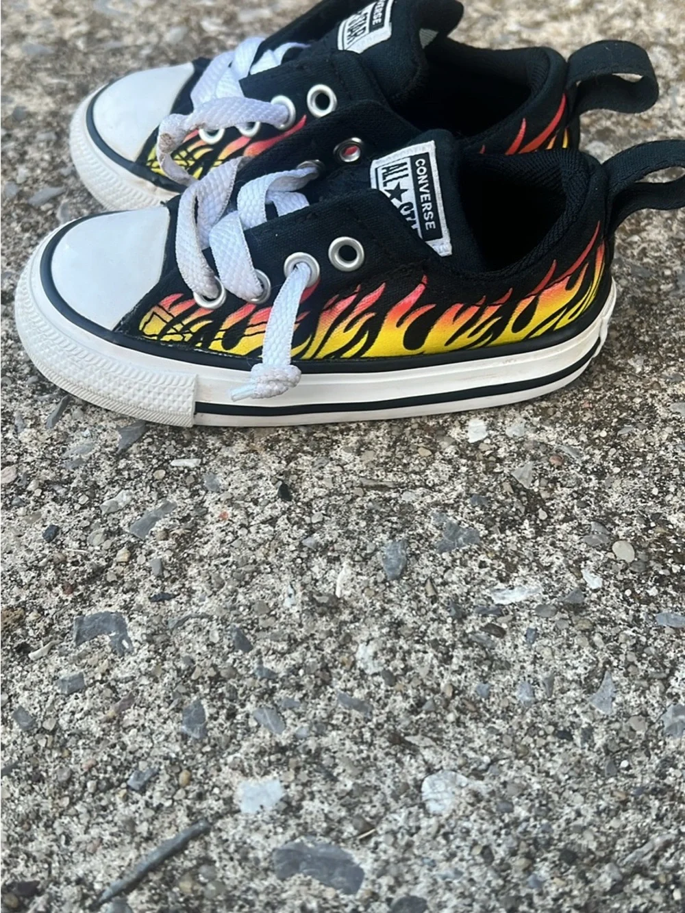 Converse Kids Low-Top Sneakers in Black with Red and Yellow Flame Print
